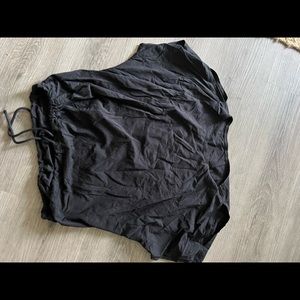 Black Lululemon shirt with a tie and slits in the shoulder